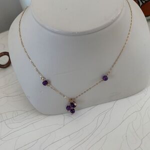 14K YELLOW GOLD AND AMETHYST DROP NECKLACE WITH THREE DANGLING GOLD PIECES